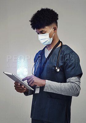 Buy stock photo Man, doctor and digital tablet for global communication or healthcare research with covid mask. Male medical expert on technology for data, networking or hologram against a grey studio background