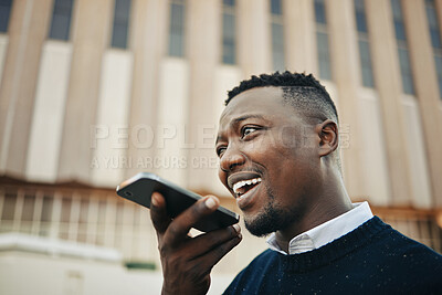 African American businessman using a cellphone in the city