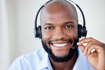 Black sales agents wearing a headset while working in a call centre. Helping with customer care and services