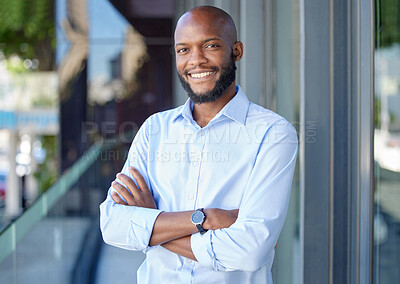 Buy stock photo Confidence, crossed arms and portrait of a businessman in the city by a office building. Success, happy and professional African male financial analyst standing outside his workplace in an urban town