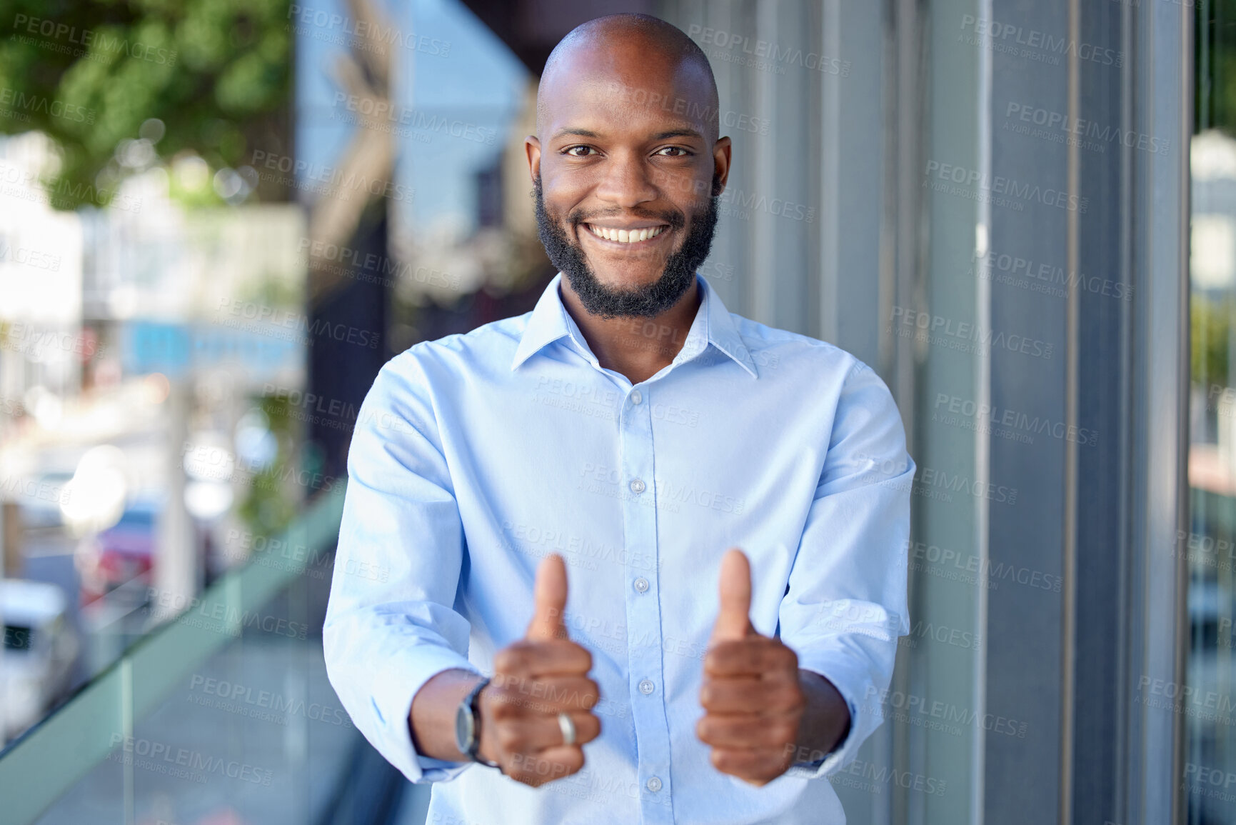 Buy stock photo Thumbs up, thank you and portrait of a black man entrepreneur happy for startup or company success in office building. Agree, yes and young employee or person with agreement sign, gesture and smile