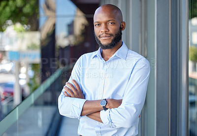 Buy stock photo Serious, crossed arms and portrait of a businessman with confidence in city by office building. Success, happy and professional African male financial analyst standing outside workplace in urban town