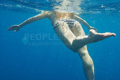 Buy stock photo Shot of an unrecognisable woman swimming in the Mediterranean Sea in Italy