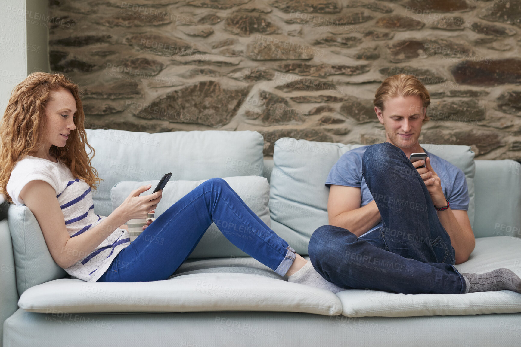 Buy stock photo Phone, relax and couple on sofa outdoor of home networking on social media, online or mobile app. Rest, technology and young man and woman on cellphone for communication, connectivity or contact.