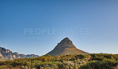 Buy stock photo Landscape view of Lions Head in Cape Town, South Africa during a day. Beautiful mountains against a blue sky with copyspace. Travelling and exploring mother nature through hiking adventures in summer