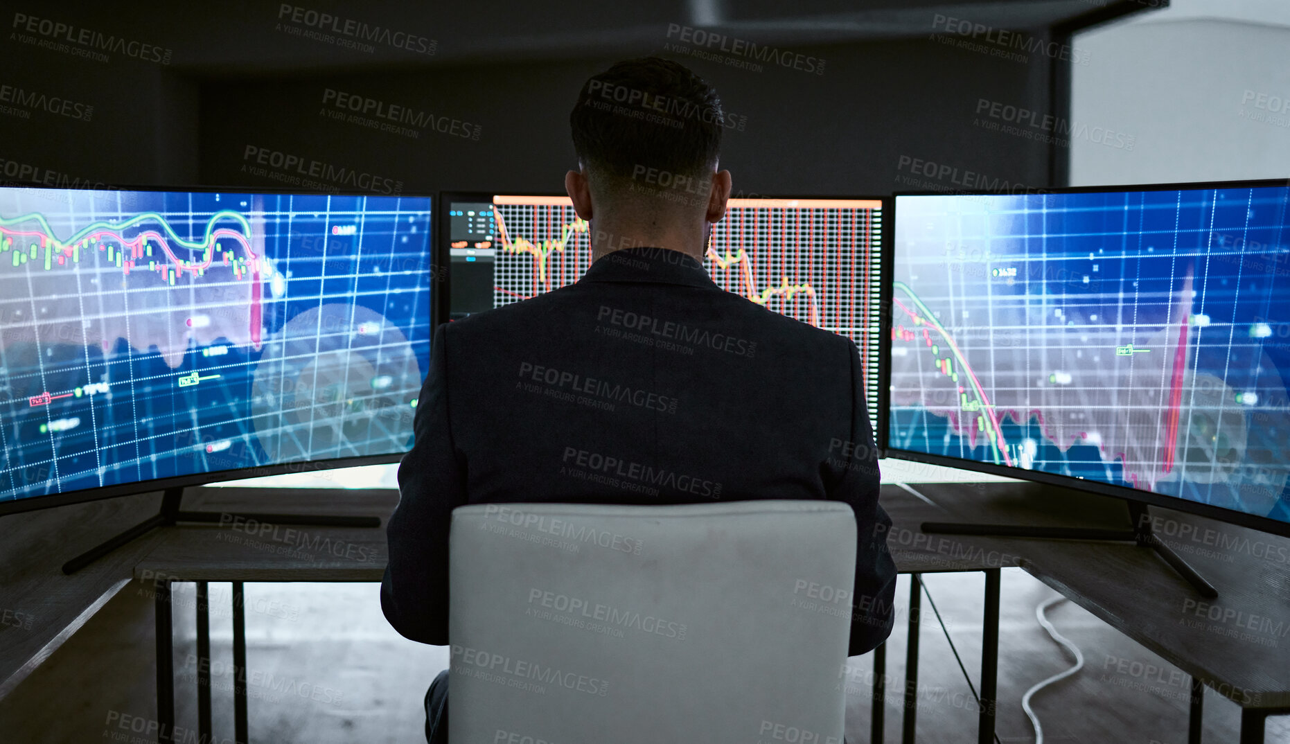 Buy stock photo Rear view of businessman using multiple monitors and trading on the stock market in a financial crisis. Trader online in a bear market with stocks crashing. Market crash and economy depression or failure