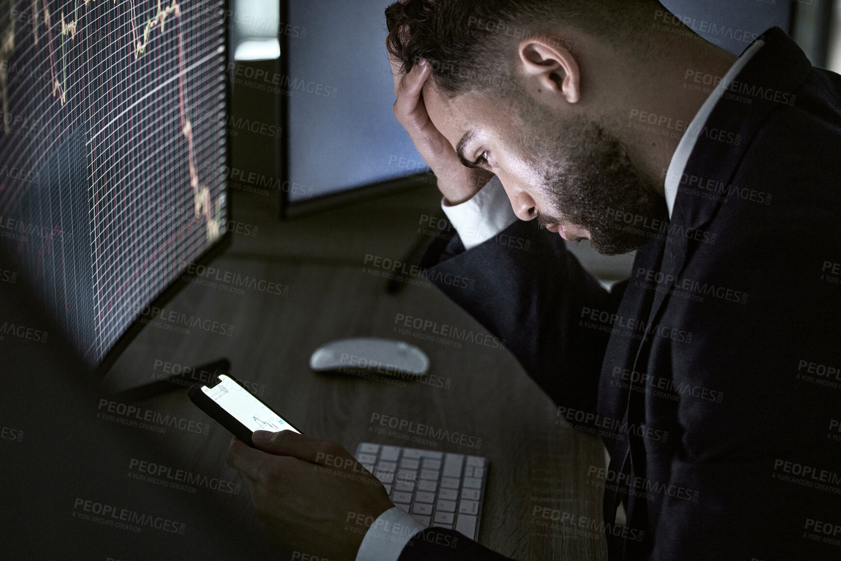 Buy stock photo Stressed businessman using a smartphone, trading on the stock market in a financial crisis. Trader working online in a bear market with stocks crashing. Market crash and economy depression or failure