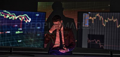 Buy stock photo Businessman with depression and a headache analysing the stock market and trading during a financial crisis. Trader in a bear market, looking at stocks crashing. Market crash and economy failure