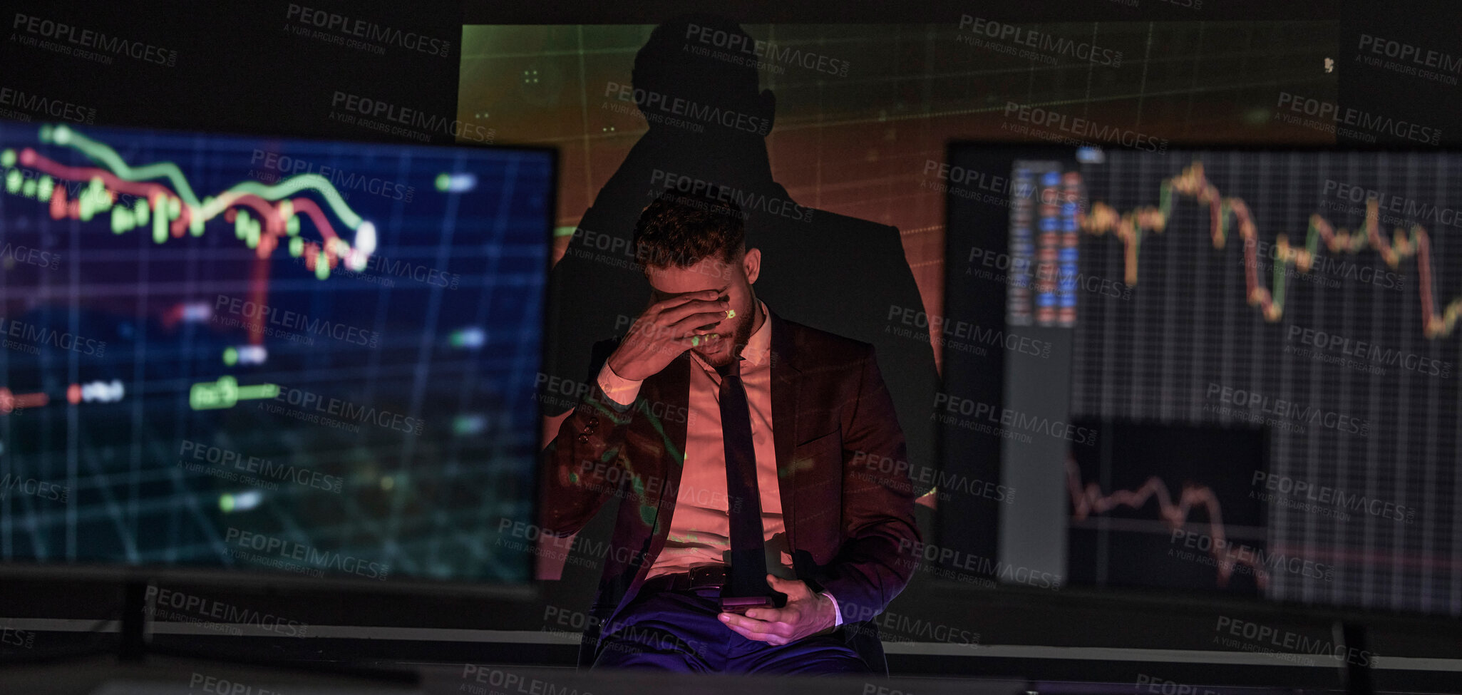 Buy stock photo Businessman with depression and a headache analysing the stock market and trading during a financial crisis. Trader in a bear market, looking at stocks crashing. Market crash and economy failure