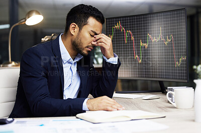 Buy stock photo Businessman with depression analysing the stock market and trading during a financial crisis. Stressed trader in a bear market, looking at stocks crashing. Market crash and economy failure