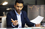 Stressed businessman trading on the stock market in a financial crisis. Trader in a bear market with paper, looking at stocks crashing. Market crash, stock default and economy failure or depression