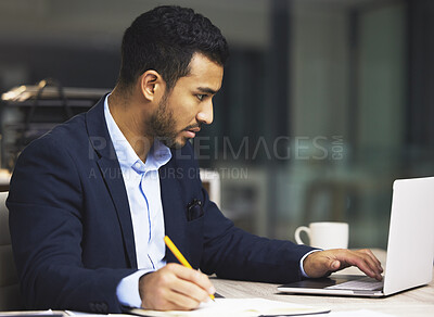 Buy stock photo Stressed businessman using a laptop, trading on the stock market in a financial crisis. Trader working online with a computer in a bear market. Market crash and economy depression or failure