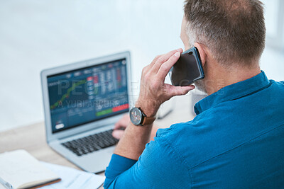 Buy stock photo Closeup of a businessman using a phone and laptop, trading on the stock market in a financial crisis. Online trader with computer in a bear market. Virtual or remote work in market and economy crash
