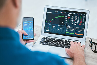 Buy stock photo Closeup of a businessman using a phone and laptop, trading on the stock market in a financial crisis. Online trader with computer in a bear market. Virtual or remote work in market and economy crash