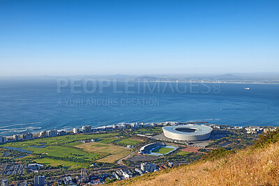 Buy stock photo Above panoramic photo of a the central business district of Cape Town, Western Cape, South Africa. A busy peninsula where land meets sea against a cloudscaped blue sky. A beautiful mountainside city