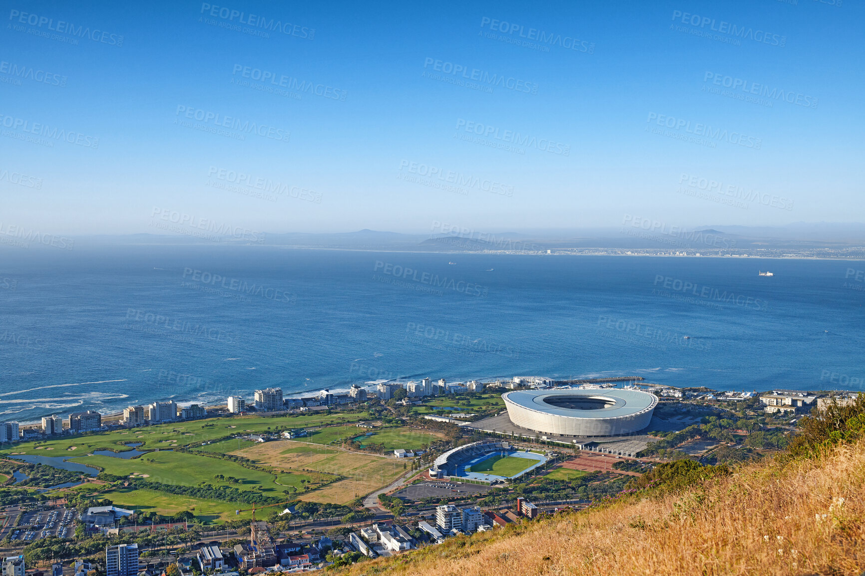 Buy stock photo Above panoramic photo of a the central business district of Cape Town, Western Cape, South Africa. A busy peninsula where land meets sea against a cloudscaped blue sky. A beautiful mountainside city