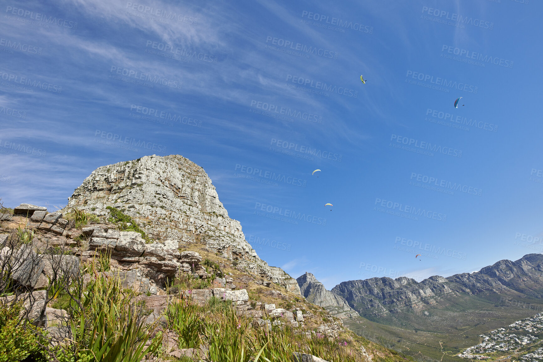 Buy stock photo Landscape, mountain and paragliding with blue sky in environment for eco tourism, scenery or space. Flying, people and summit outdoor in natural green habitat for summer activity in national park