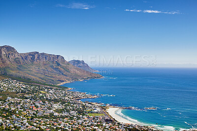 Buy stock photo Aerial view of town near sea against sky