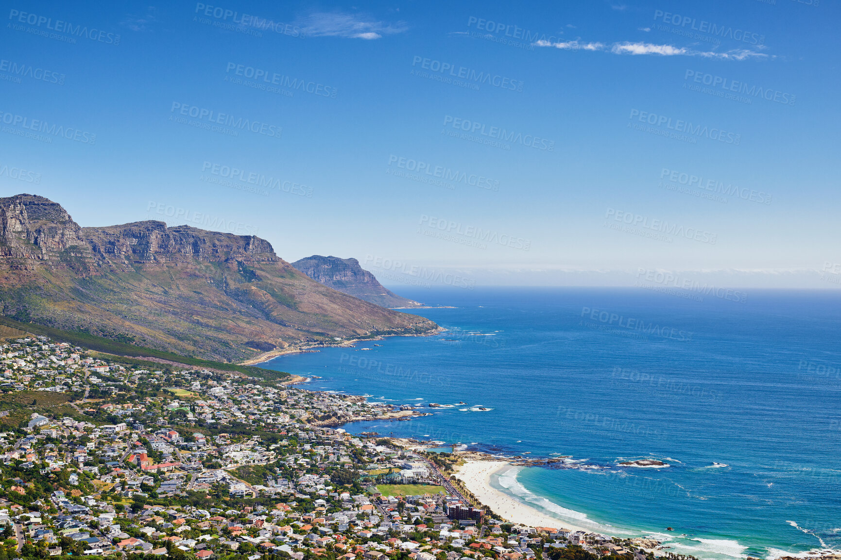 Buy stock photo Aerial view of town near sea against sky