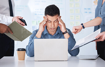 Buy stock photo Stressed mixed race businessman being nagged by colleagues. Irritated and annoyed hispanic professional man feeling frustrated and suffering from a headache in an office. Interns disturbing a manager