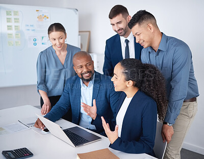 Buy stock photo Diverse group of business people talking in a meeting and using technology and paperwork in a boardroom. Team of professionals sitting together, brainstorming and planning a strategy in the office