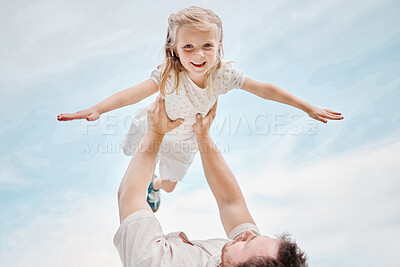 Low angle portrait of an adorable little caucasian girl being carried by her fun playful father while outside in a garden. Smiling cute daughter bonding with her dad in the backyard. Playing aeroplane