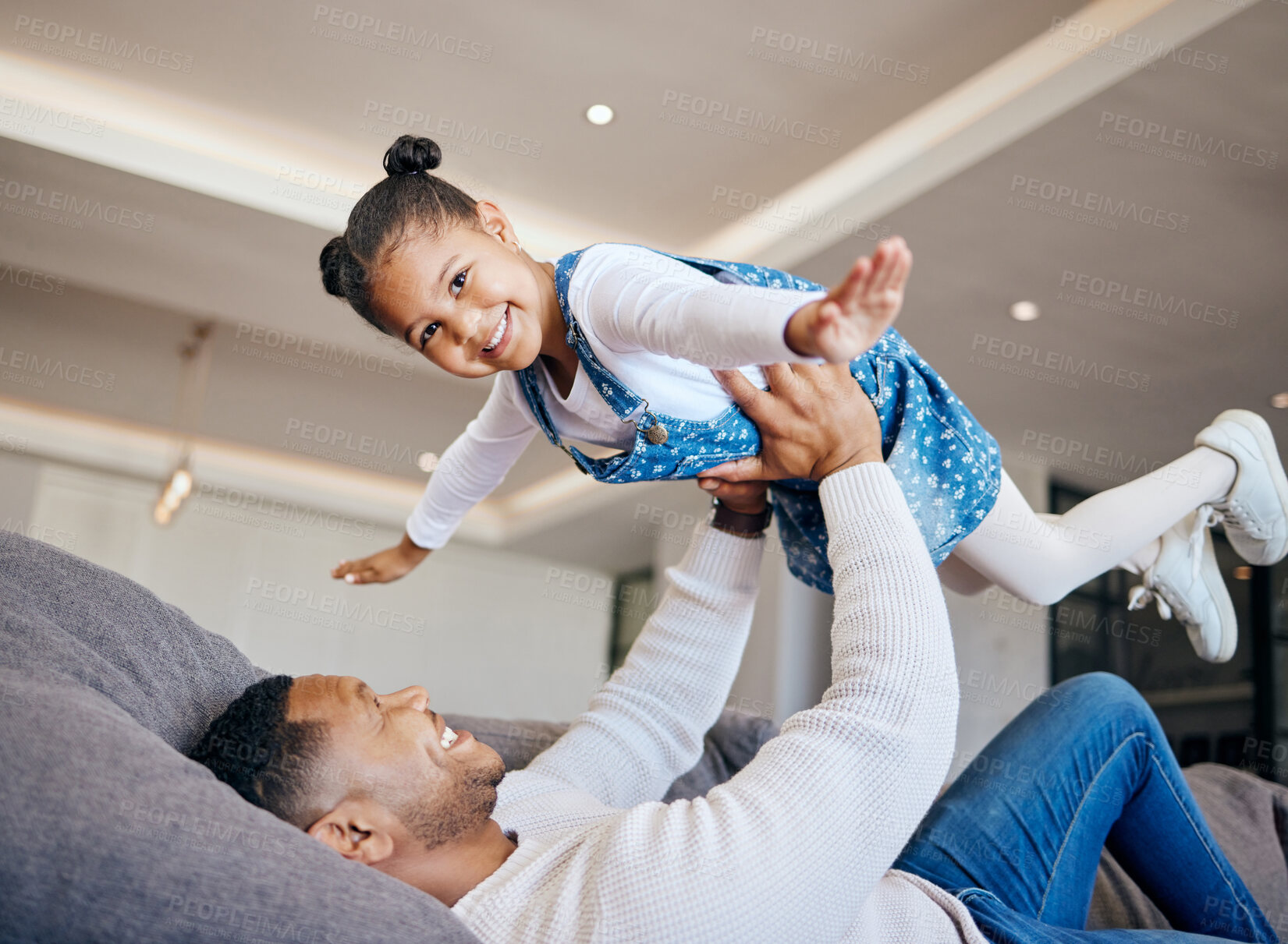 Buy stock photo Father, child and airplane play at home, fun and bonding in childhood, love and smile for freedom. Happy, dad and daughter on couch, flying and portrait or face, joy and excited for fantasy game