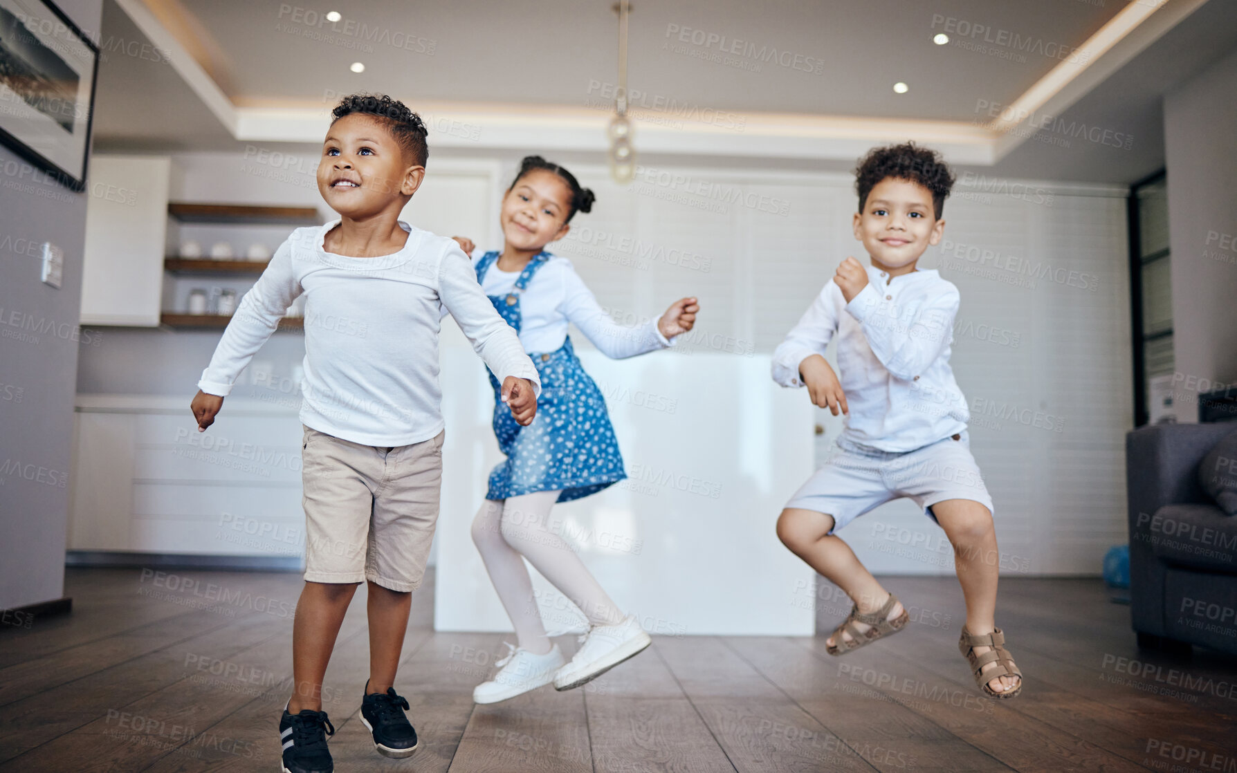 Buy stock photo Family, children and siblings dance in a house with energy, moving and music at home together. Love, freedom and kids in living room for fun jump games, bond and celebration of vacation or weekend