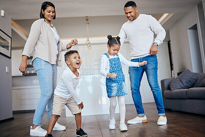 Buy stock photo Dance, love and energy with a family having fun in the living room of their home together. Freedom, smile or happy with a mother, father and excited children moving or playing in their apartment