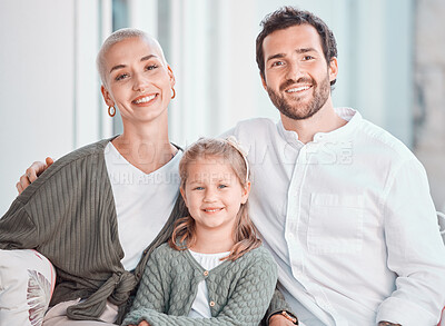 Buy stock photo Mother, father and girl on couch, portrait and smile with care, bonding and hug for love in home living room. Mom, dad and child with happy embrace on lounge couch, relax and pride in family house