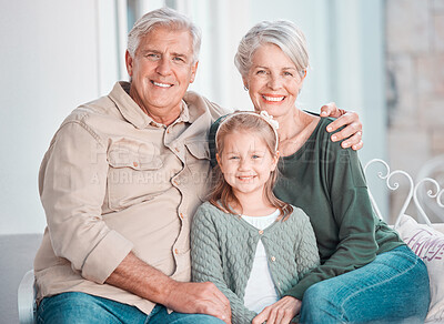 Buy stock photo Grandparents, girl and portrait on couch, smile or hug for care, bonding or love in home living room. Old man, elderly woman and kid with happy embrace on lounge sofa, relax and pride in family house