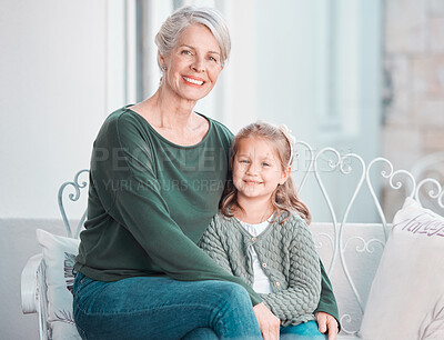 Buy stock photo Senior grandma, child and portrait on sofa with hug, care and bonding with love, lounge and family home. Elderly woman, girl and embrace with smile, relax and together on living room couch in house