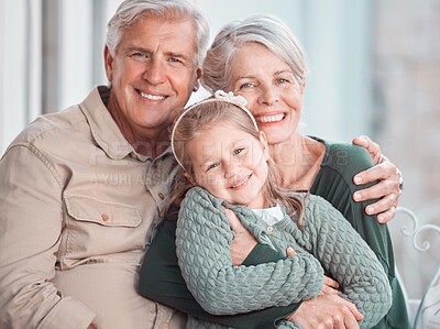 Buy stock photo Grandparents, hug and portrait on sofa with child, care and bonding with love, retirement and home living room. Happy old man, elderly woman and embrace girl in lounge, relax and pride in apartment
