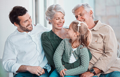 Buy stock photo Grandparents, girl and happy with dad on sofa for hug, care or bonding with love in family home lounge. Elderly people, kid and father with smile, relax and conversation on living room couch in house