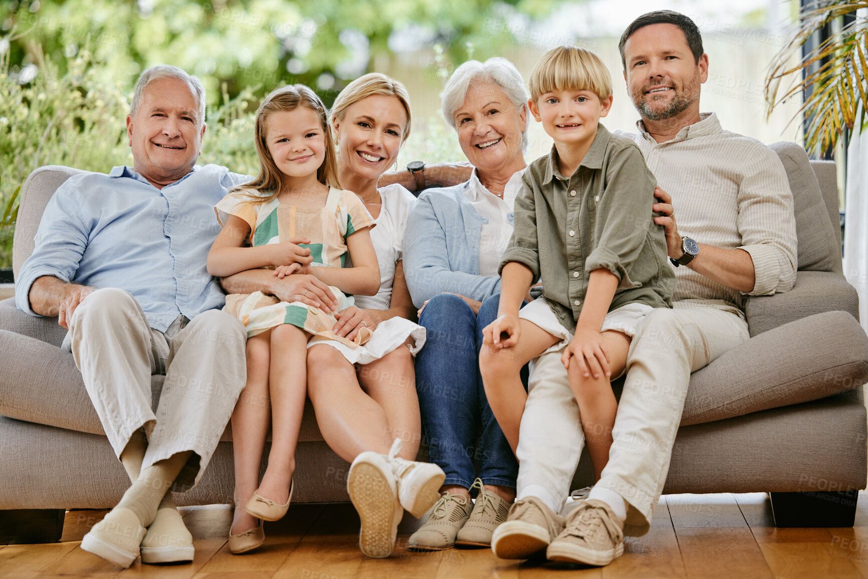 Buy stock photo Smile, happy and portrait of big family on a sofa relaxing in the living room of modern house. Bonding, love and young children together, resting and sitting with grandparents and parents at home.