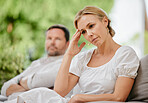 Mature woman looking upset and annoyed after arguing with her husband about marriage problems. Feeling negative. This relationship could end in divorce if they continue to disagree and fight. 