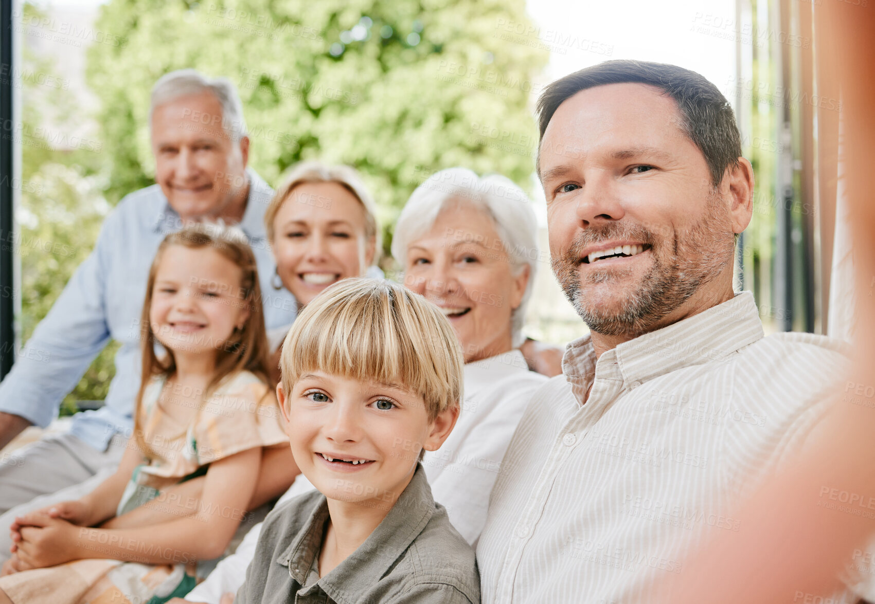 Buy stock photo Love, selfie and a big family on a sofa in the living room of their home together during a visit. Portrait, photograph or memory with happy children, parents and grandparents bonding in an apartment