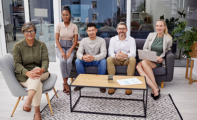 Buy stock photo Full body portrait of diverse group of businesspeople sitting in the office at night and brainstorming. Team of professional workers working a deadline and using a laptop and paperwork in a meeting