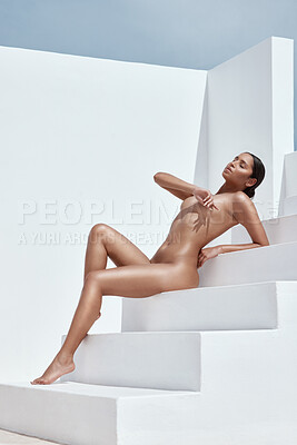 Graceful naked woman in sensual pose in studio - Stock Photo