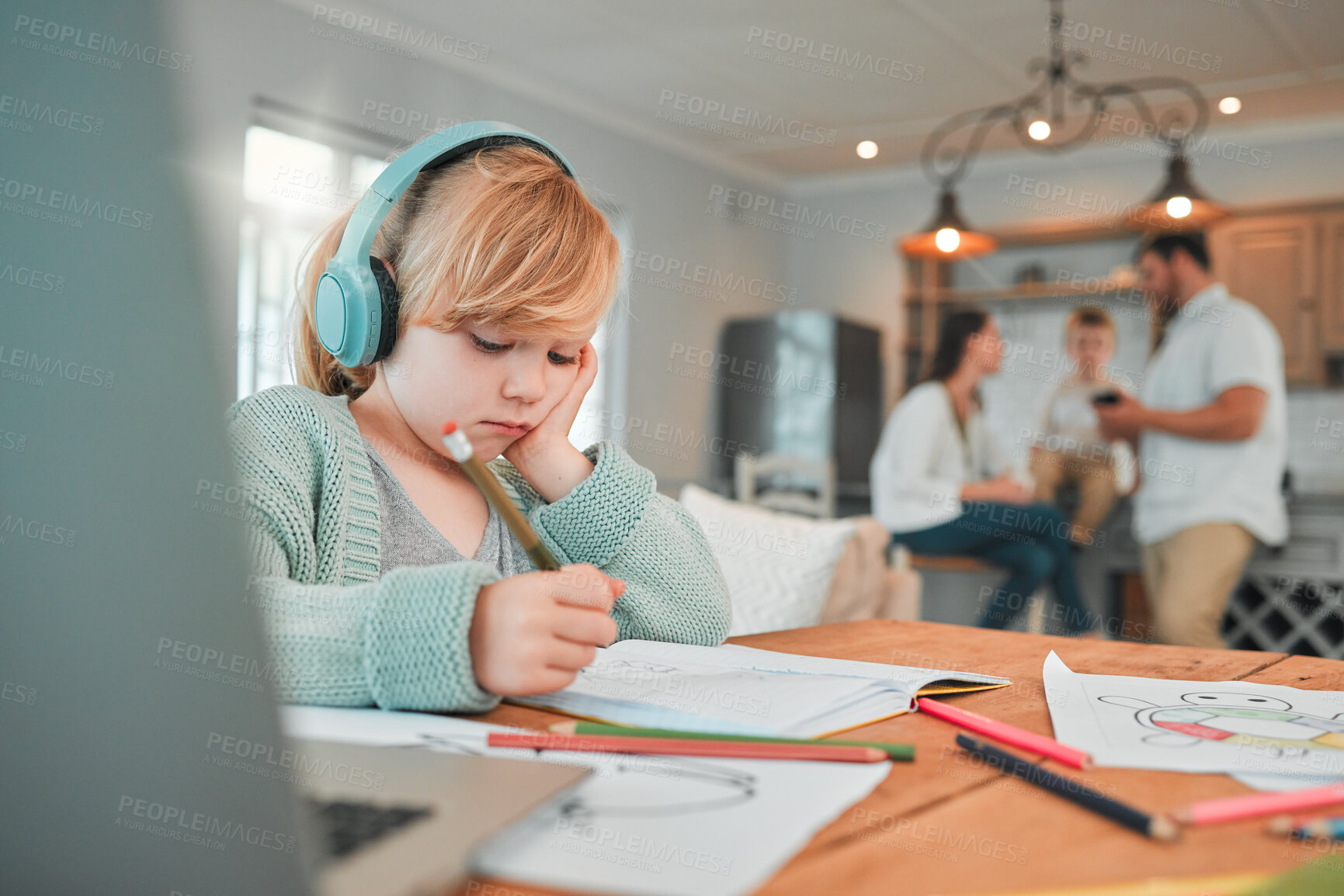 Buy stock photo Girl, writing and book with headphones for elearning, study or homework in living room or table at home. Young female person, kid or child taking notes or homeschool with headset for online learning