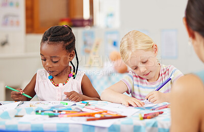 Buy stock photo Children, pencil and drawing for homework in classroom with creative, art or project for picture. Little girl, friend and diversity with serious look for learning, education and decision for coloring