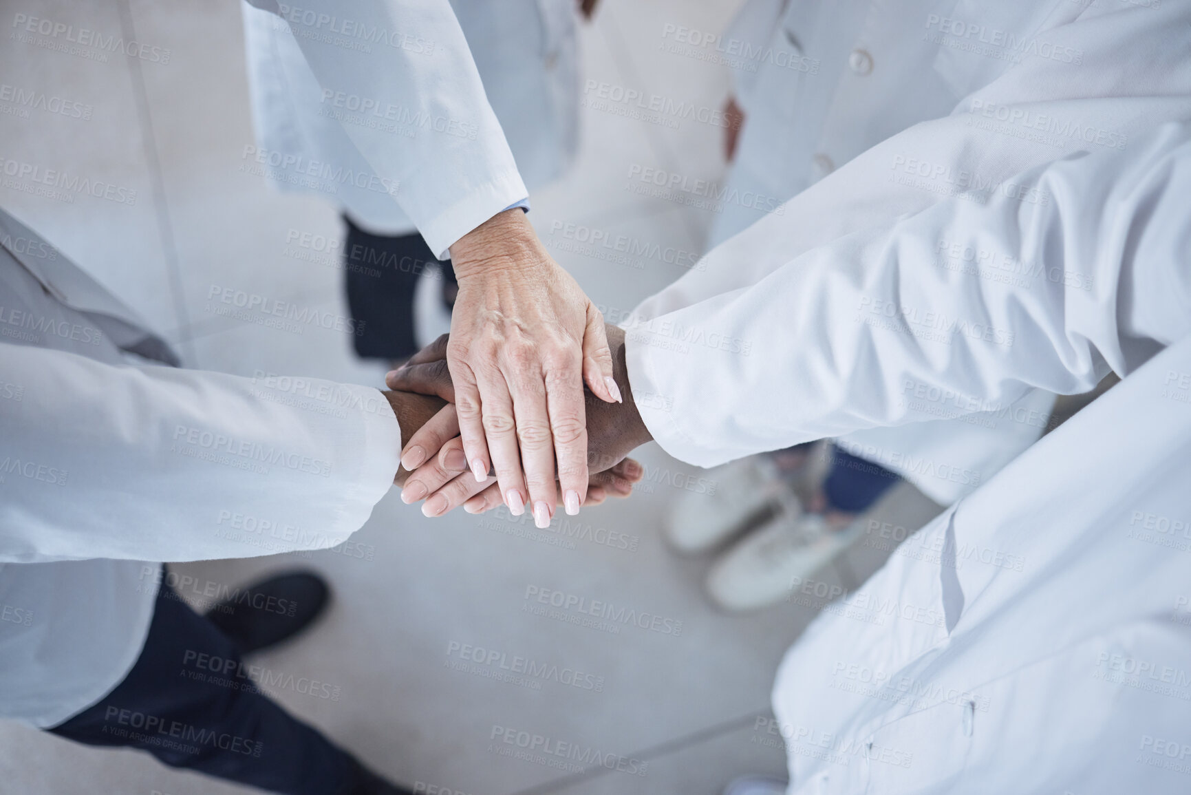 Buy stock photo Hands, teamwork and doctors in the hospital for motivation or solidarity in medicine or healthcare. Medical, support or unity with a group of health professionals closeup in a clinic from above