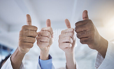 Buy stock photo Closeup of diverse group of unknown healthcare professionals using hand gestures to show a thumbs up in the clinic. Medical staff and doctors with sign of approval and symbol of trust in a hospital
