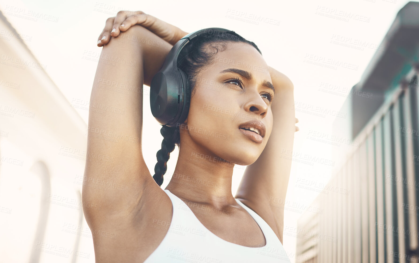 Buy stock photo Stretching, city and woman with headphones, training and stress relief with exercise, audio and radio. Female person, athlete or girl with headset, streaming music and wellness with fitness and relax