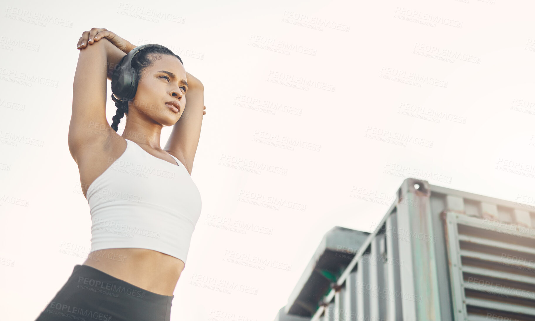 Buy stock photo Exercise, city and woman with headphones, fitness or wellness with training, podcast and stress relief. Female person, runner or girl with headset, streaming music and radio with progress and workout