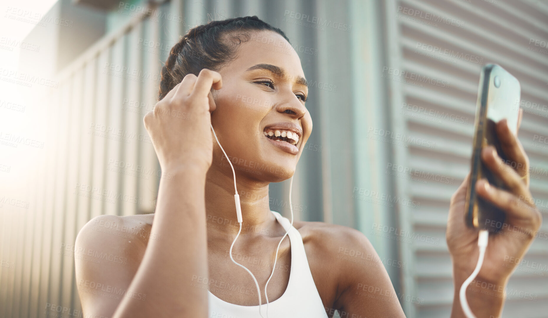 Buy stock photo Fitness, woman with smartphone and listening to music for motivation with lens flare. Happy or health wellness, workout or exercise and female athlete listen to podcast in sportswear for resilience 