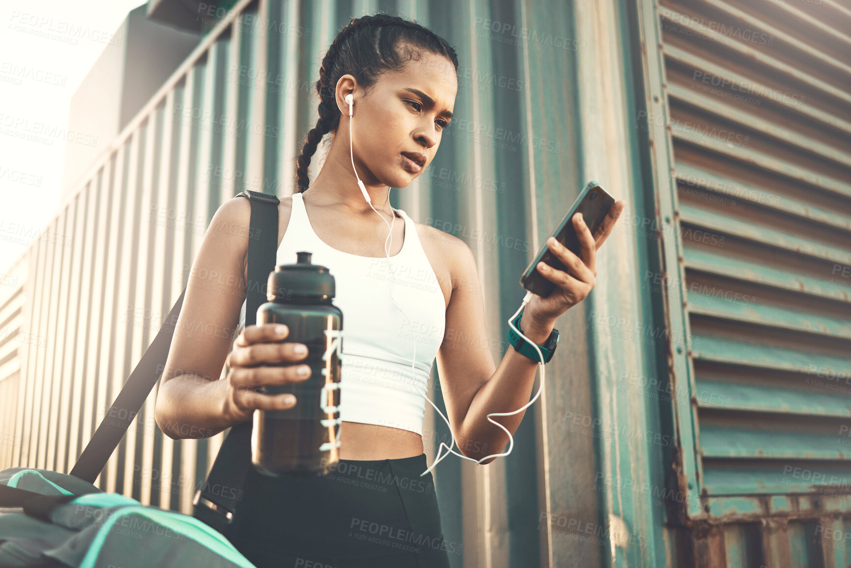 Buy stock photo Earphones, mobile app or happy girl runner in city streaming music to start training, workout or exercise. Social media, bag or sports woman athlete listening to radio or fitness podcast to relax 