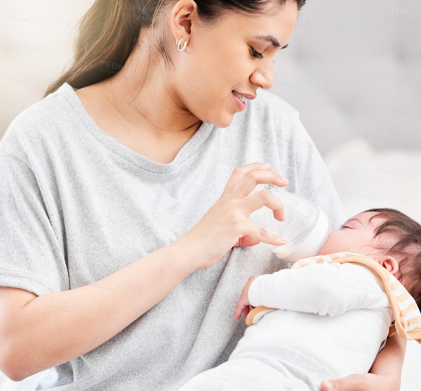 Buy stock photo Mother feeding baby milk, nutrition and bottle with early childhood development, meal and family with wellness, healthy and bonding. Child is drinking, home and mama with infant, love and care