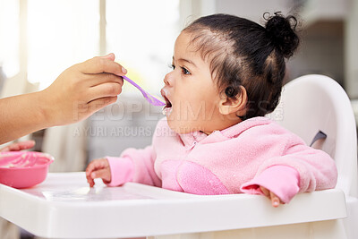 Buy stock photo Hand, spoon and child food in chair for baby development, nutrition meal or dinner snack. Kid, feed and eating breakfast hungry for parent care or love for lunch together, diet vitamin in kitchen