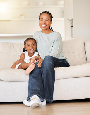 Buy stock photo Happy, smile and portrait of child with mother on sofa in the living room of modern house for bonding. Care, love and young African girl kid sitting with her mom on couch of lounge at home together.